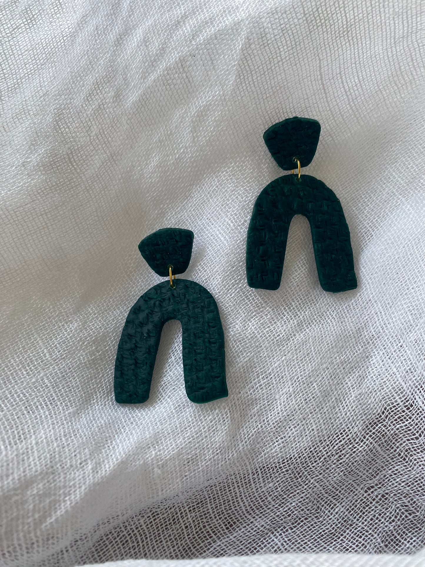 Pendientes verdes arco