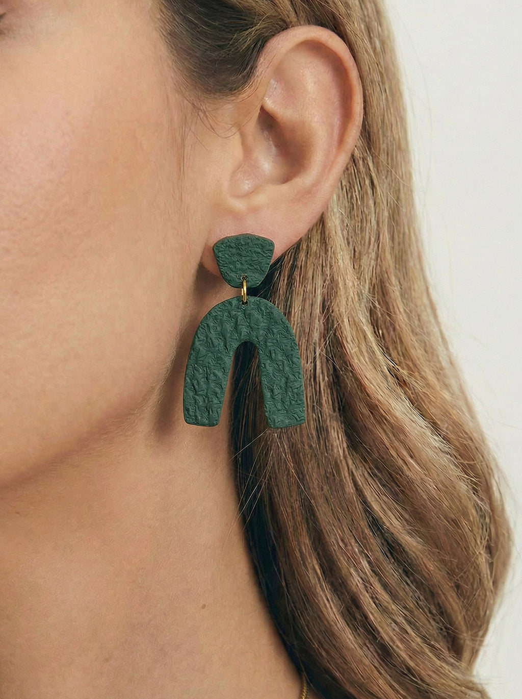 Pendientes verdes arco